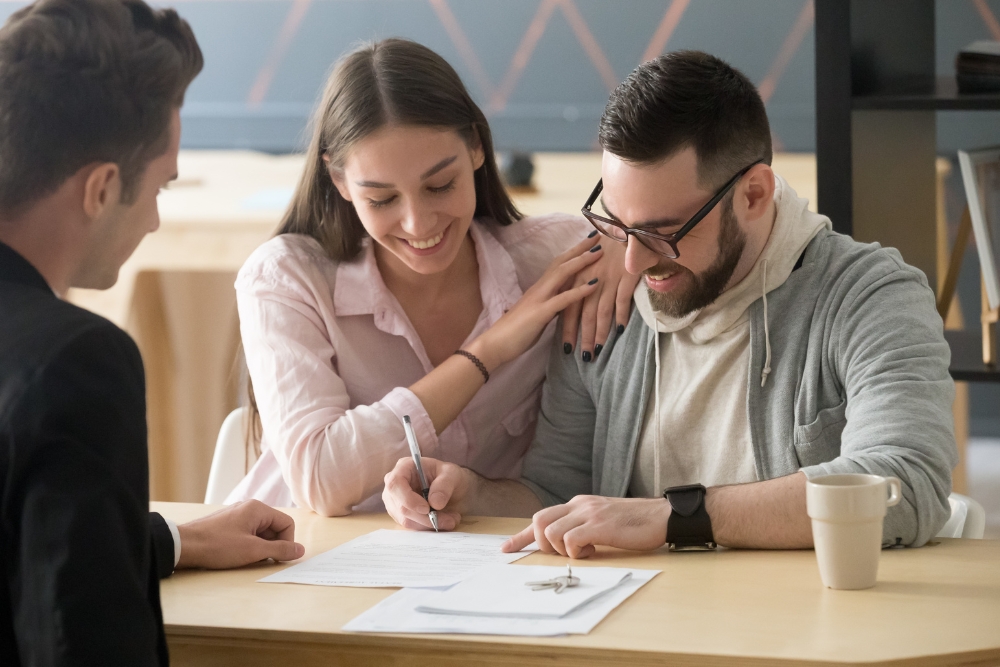 A couple signing a binding financial agreement